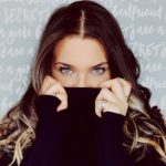 woman hiding smile